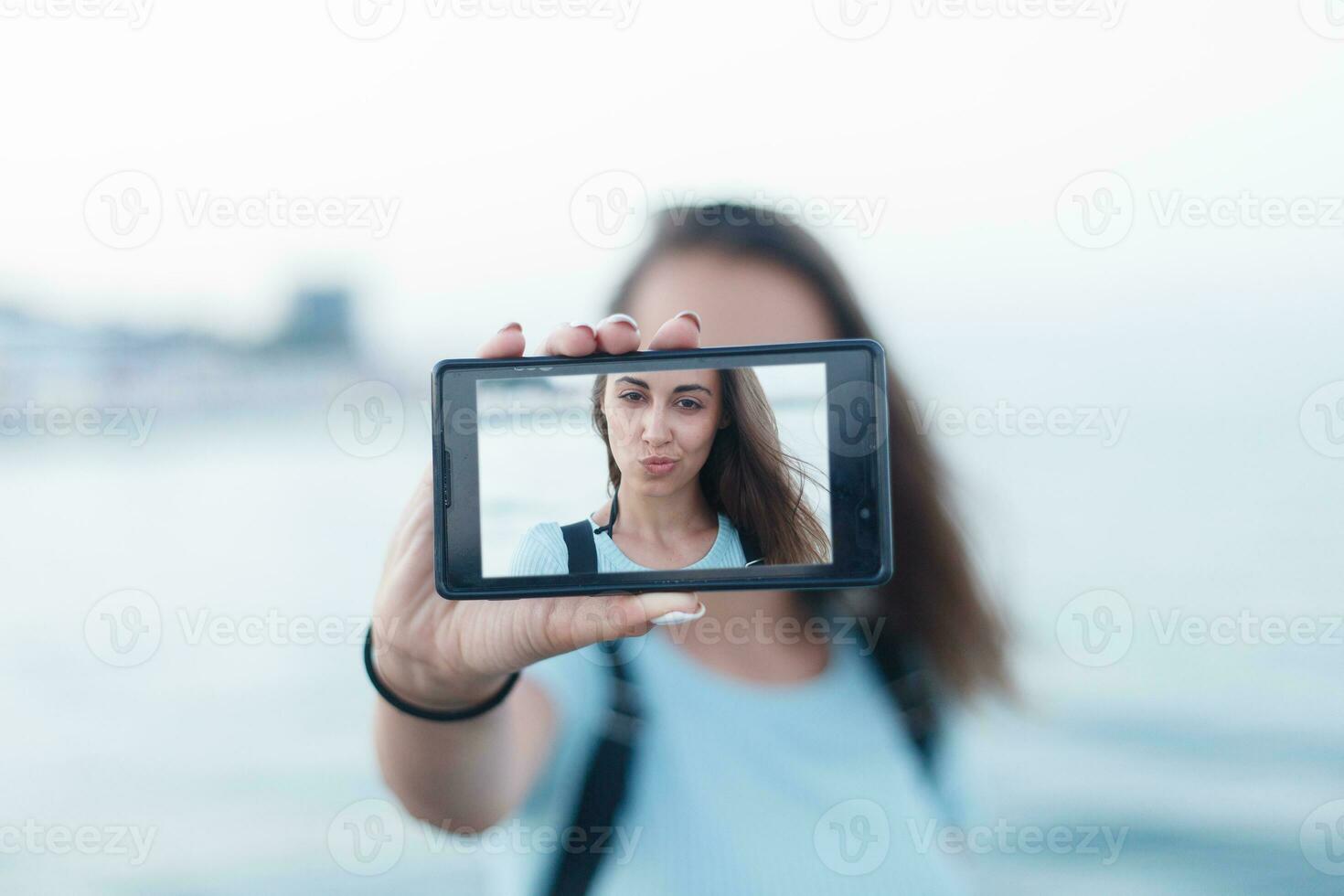 Portrait of attractive teenager girl standing photo