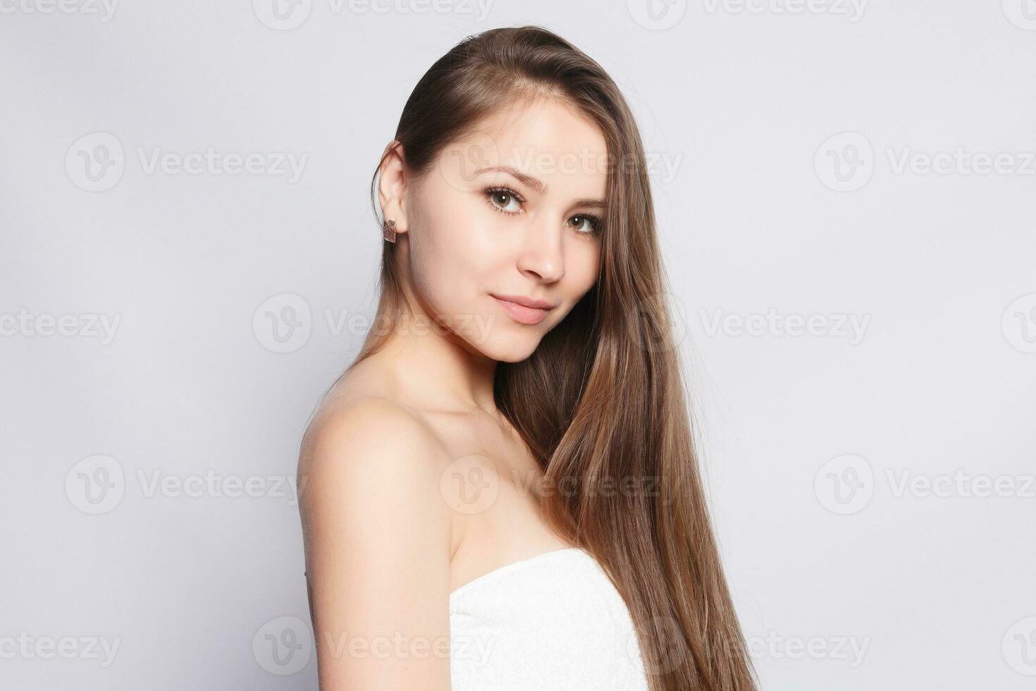 Spa Woman. Beautiful Girl After Bath Touching Her Face. photo