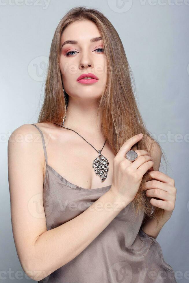 Gold earrings, ring and necklace. photo