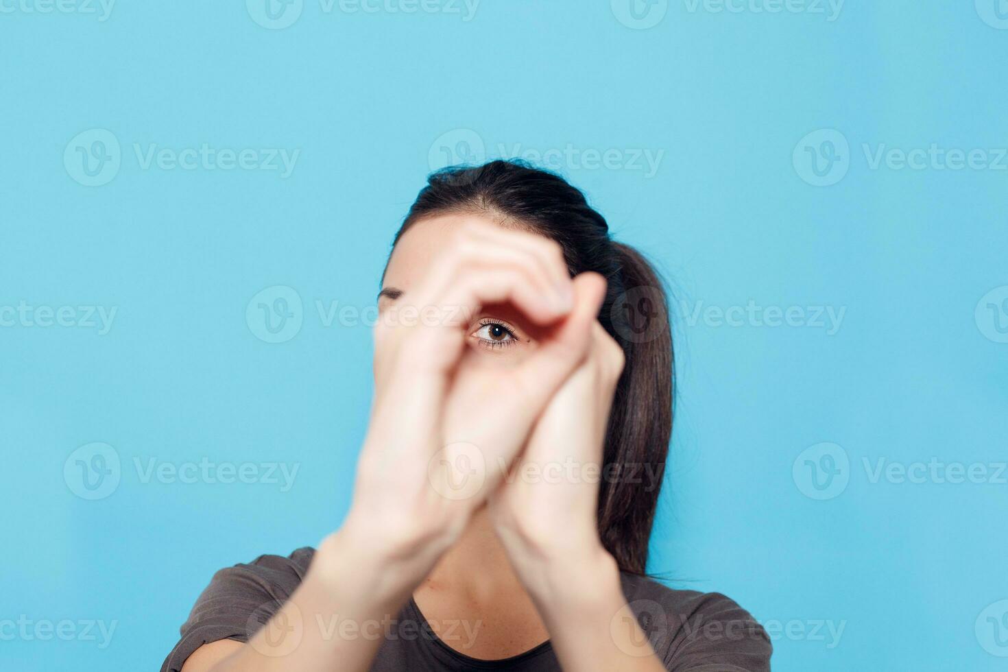 Beautiful smiling woman on blue background. photo