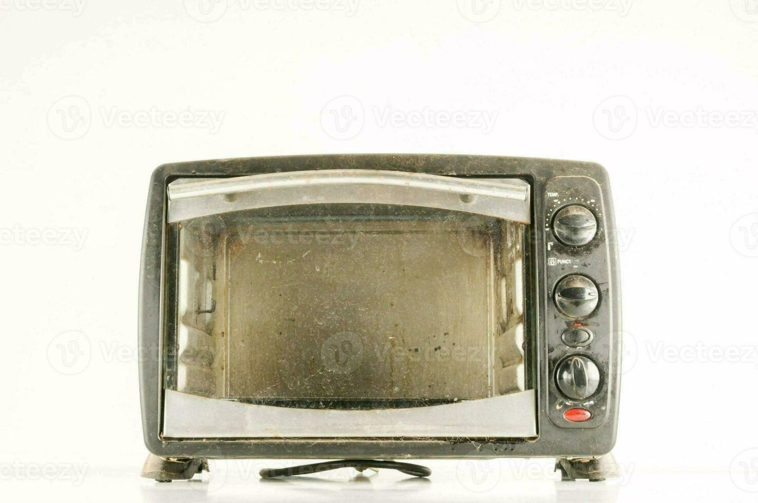 an old toaster oven sitting on a white surface photo