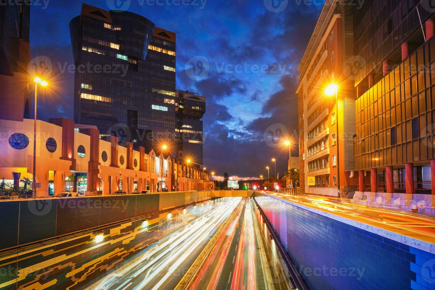 Cityscape at Dusk Long Exposure of street traffic in Lisbon, Portugal photo