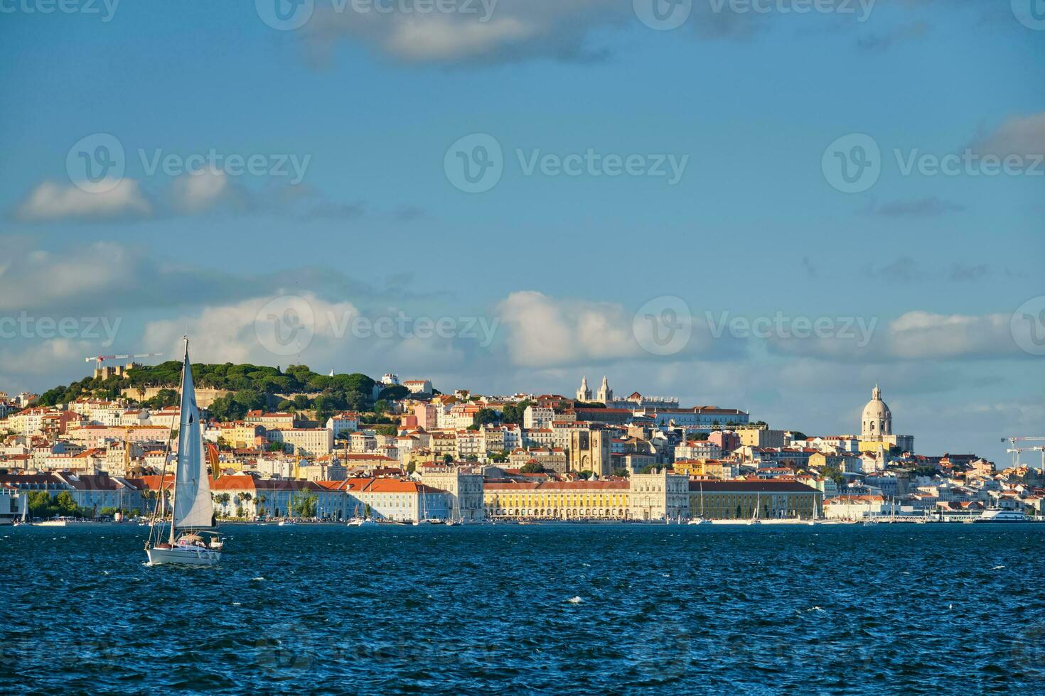 View of Lisbon view over Tagus river with yachts and boats on sunset. Lisbon, Portugal photo