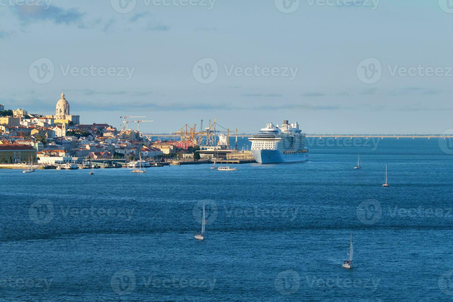 View of Lisbon view over Tagus river with yachts and boats on sunset. Lisbon, Portugal photo
