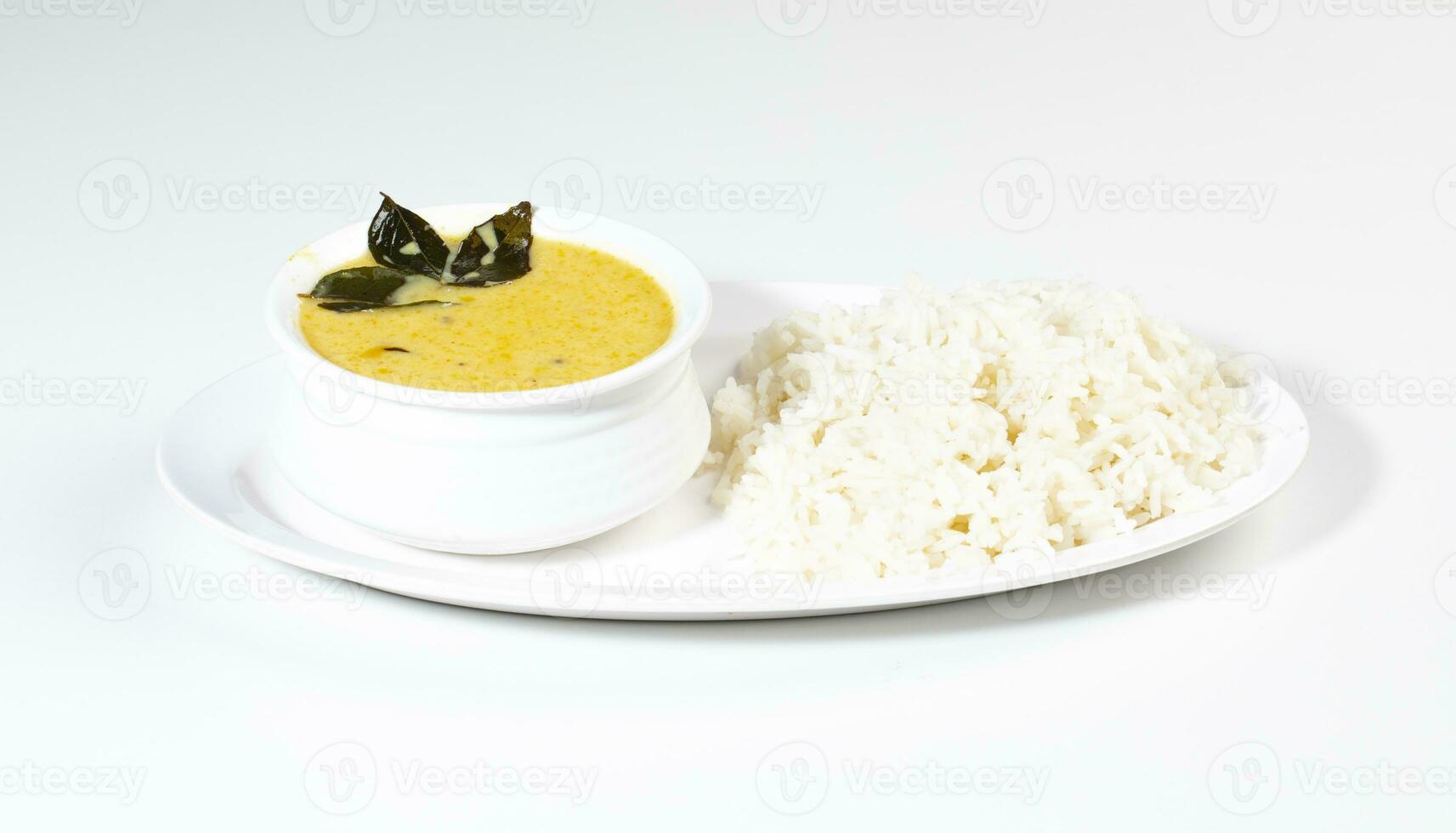 Indian Traditional Cuisine Kadhi Chawal Also Know as Curry Chawal, Yogurt Curry with Rice on White Background photo