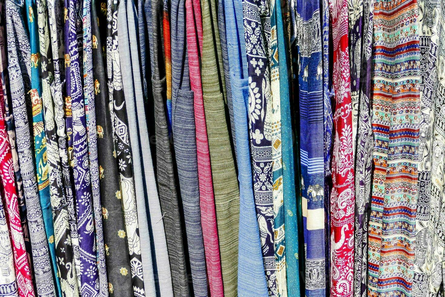 many different types of fabric are displayed in a store photo