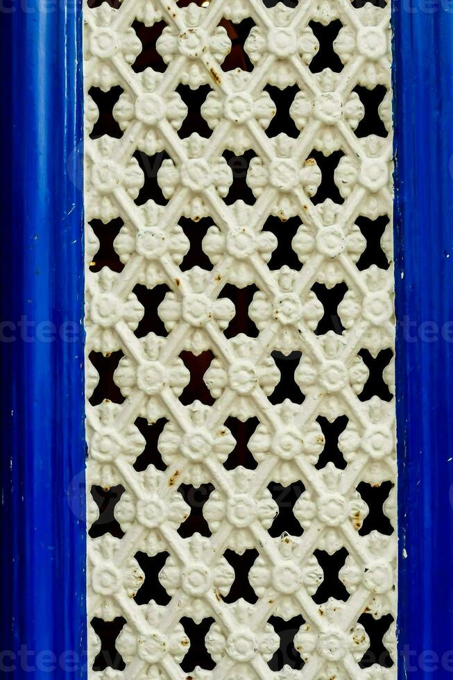 a blue frame with a pattern of crosses on it photo