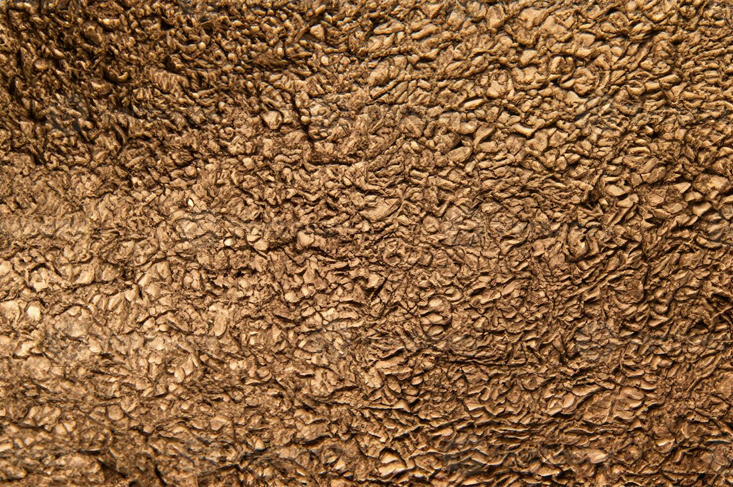 Texture of crumpled bronze foil. Metallic background photo