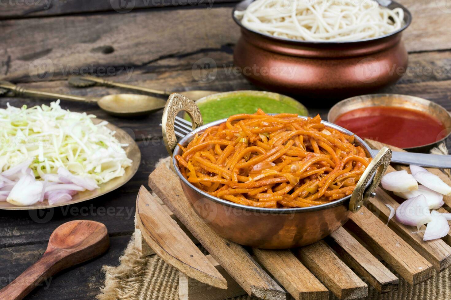 Spicy Fried Vegetable Veg Chow Mein on Wooden Table photo