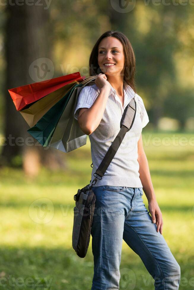 Beautiful businesswoman took a break from work to go for a shopping. photo