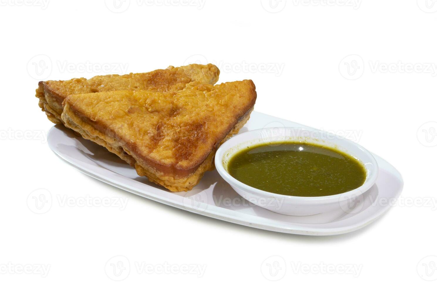 Indian Fried Snack Bread Pakora or Bread Bhaji a Common Street Food, it is Made From Bread Slices, Gram Flour, and Spices Among other Ingredients photo