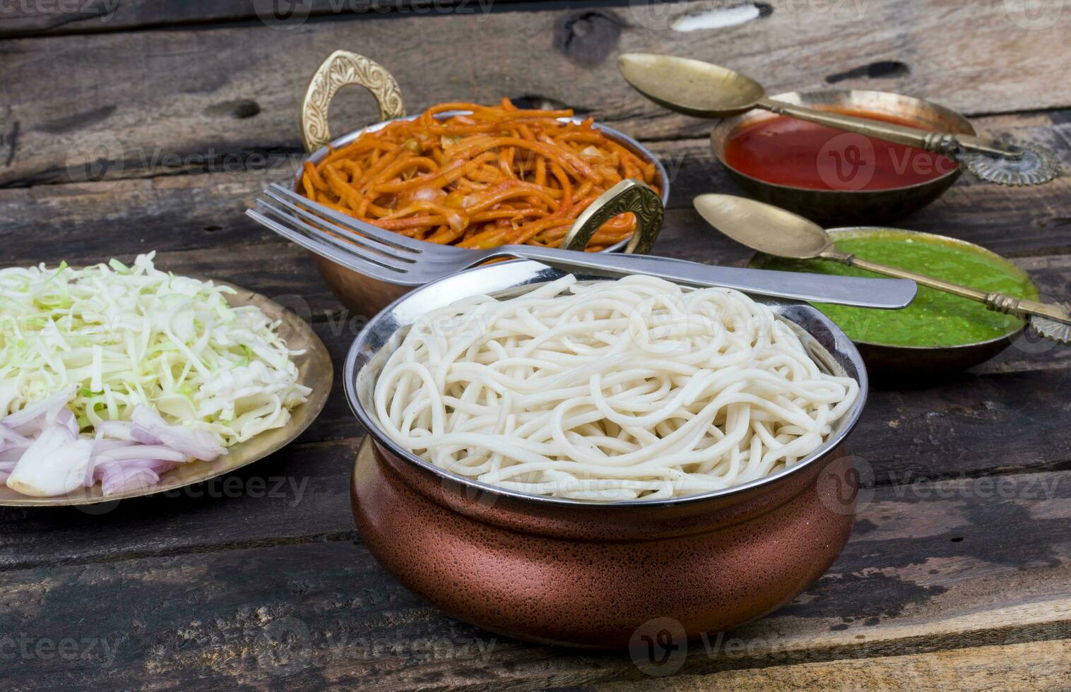 Boiled Chow Mein or Hakka Noodles Served With Chutney on Wooden Background photo