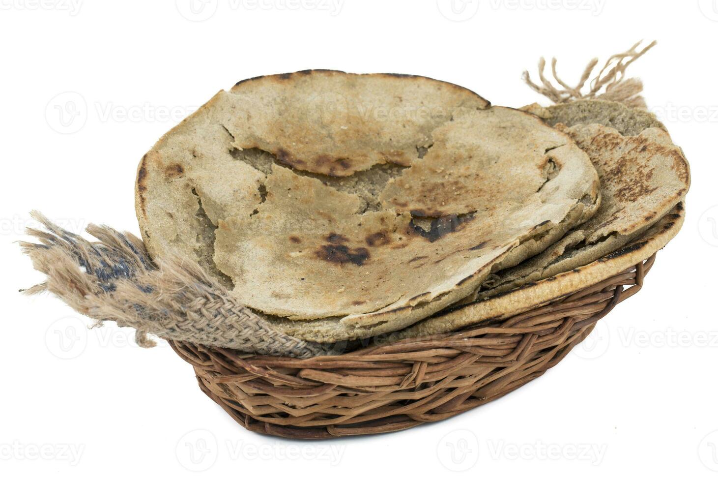 Rajasthani Bajra Roti or Bajri Roti in Basket on White Background photo