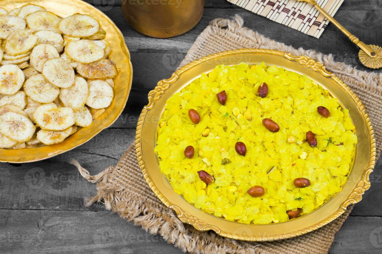 Indian Spicy And Crispy Popular Breakfast Poha Chivda on Wooden Background photo
