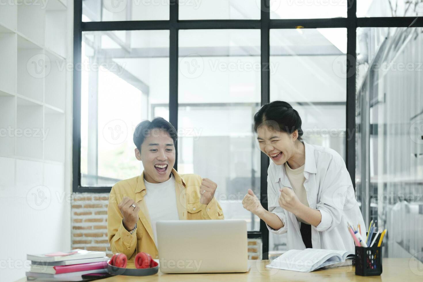 Motivated multinational team raise high fives on briefing after finding problem solution as successful brainstorm result. photo