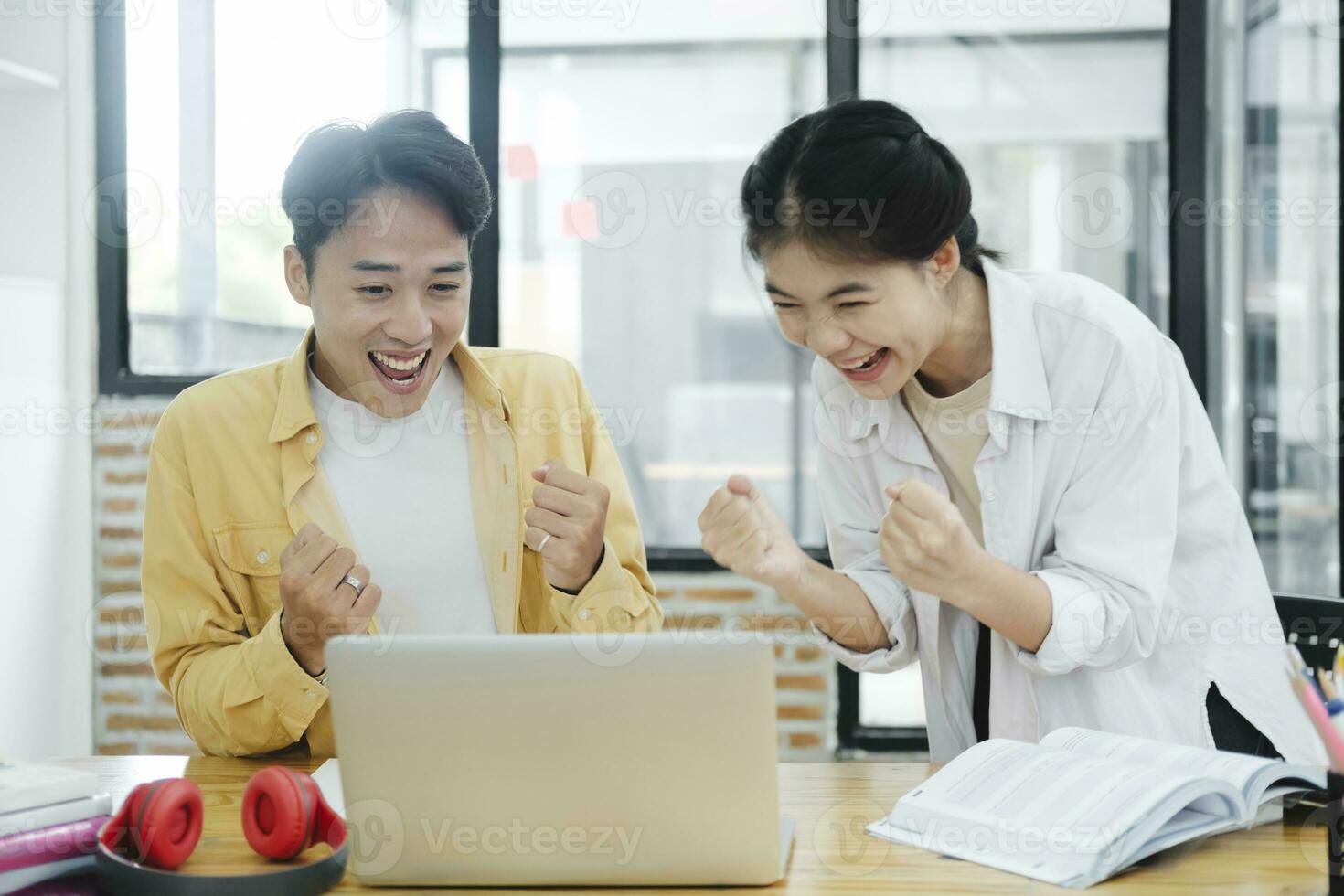 Motivated multinational team raise high fives on briefing after finding problem solution as successful brainstorm result. photo