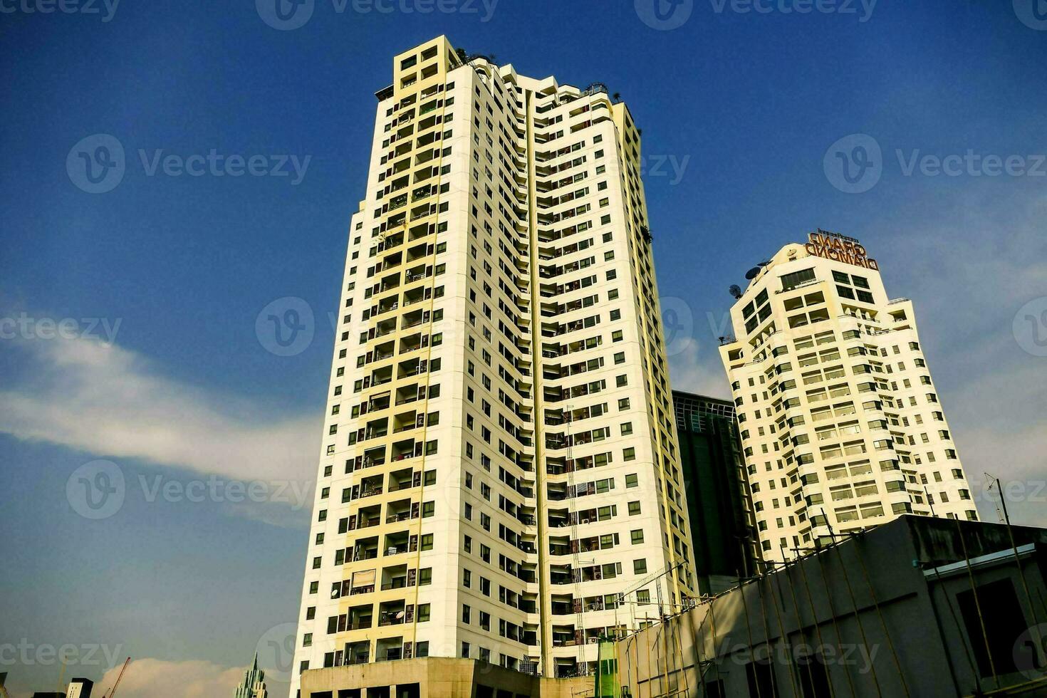 a tall building with a blue sky in the background photo