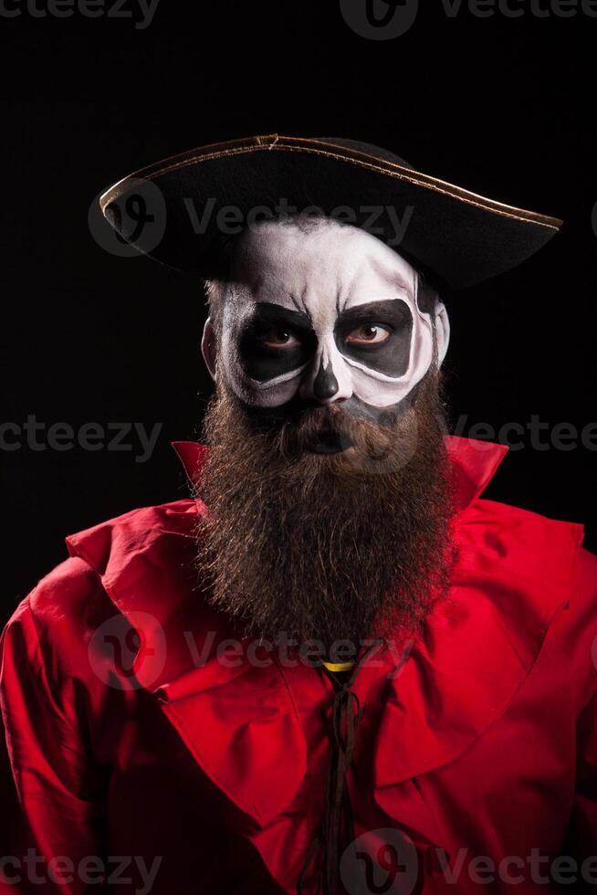 Man with a long beard dressed up like a spooky pirate for halloween. photo