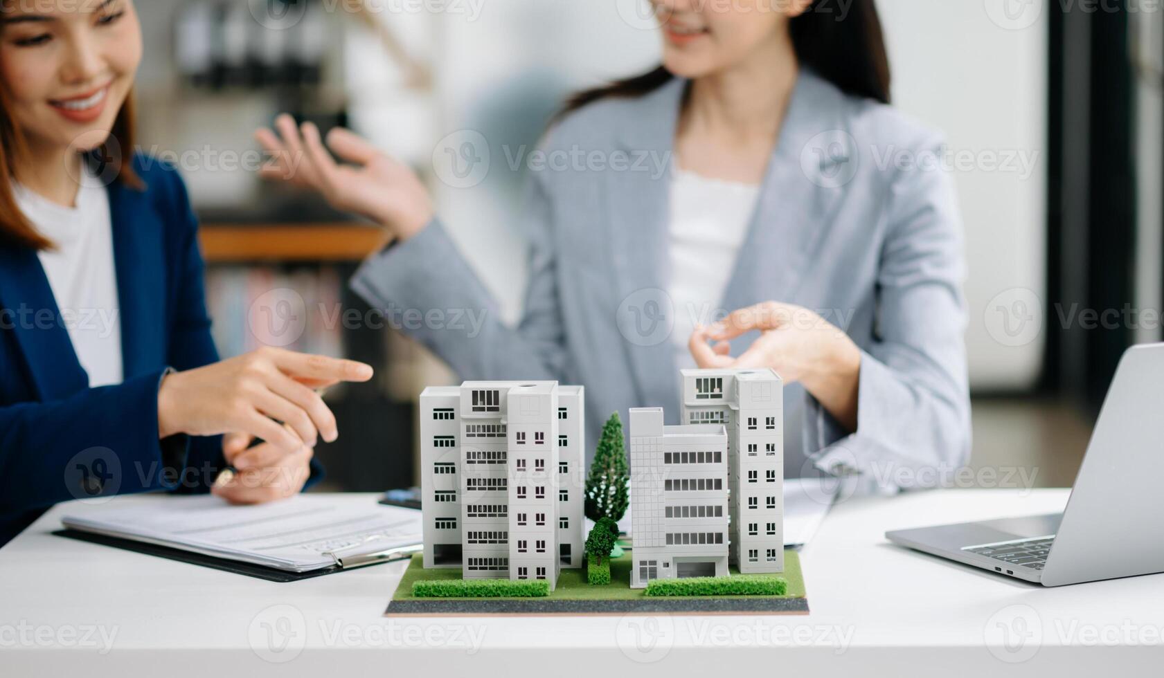 Signing a contract. Client and broker agent, lease agreement, successful deal and  Young business sitting in office photo