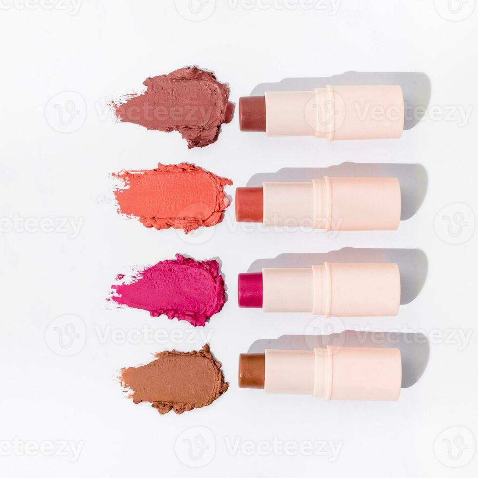 Powder makeup on white background. Texture of makeup powder smear isolated on solid background. Texture swatch or sample. Luxury cosmetics. photo