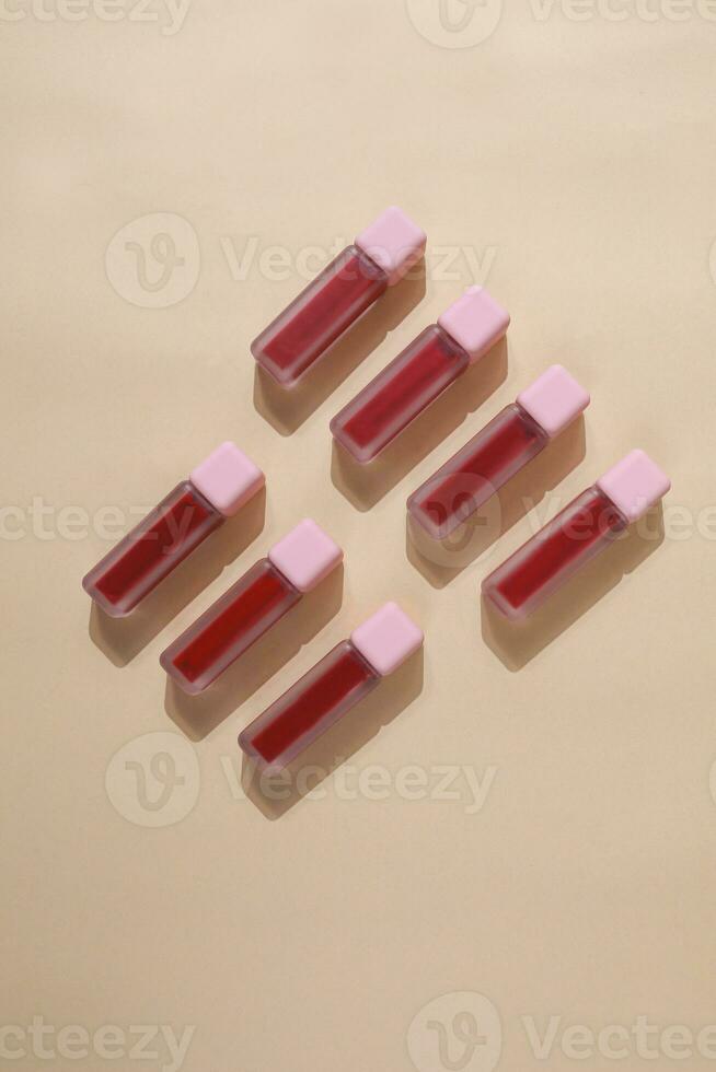 red liptint isolated with beige background, Beauty Product. Mock-up. Copy space. Flat lay style photo