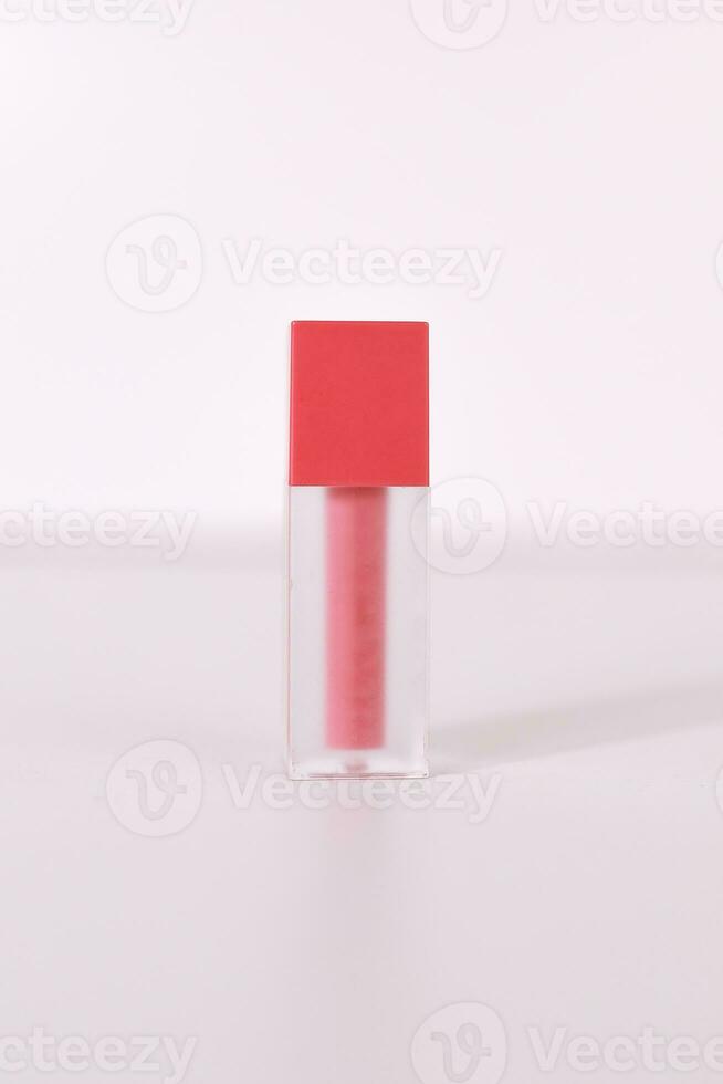 close up, bottle of lip tint glosses on white background photo