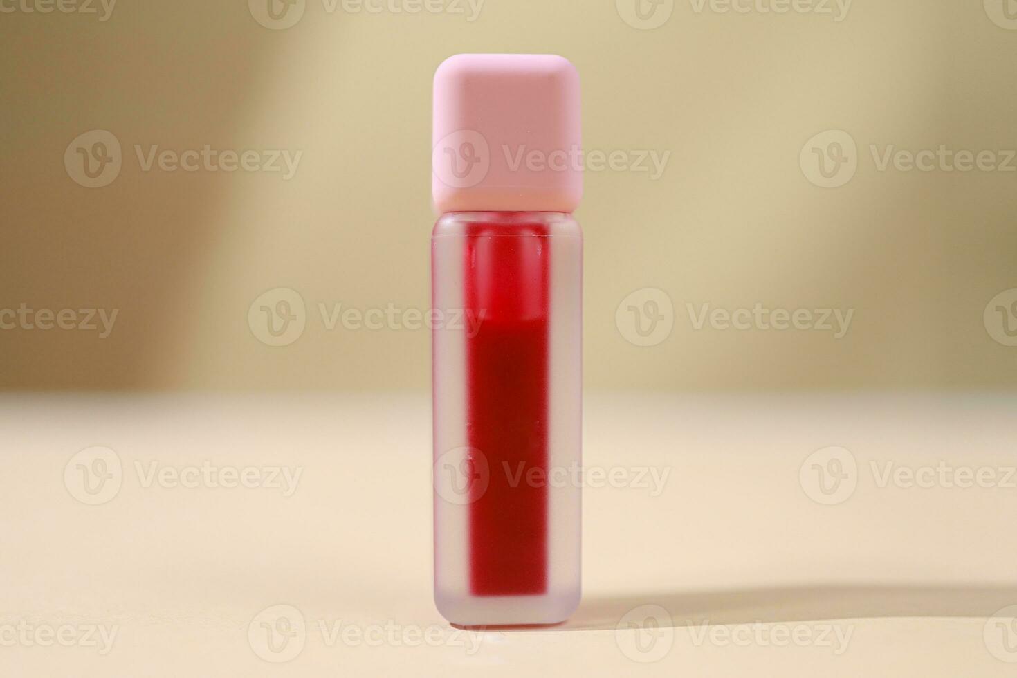 red liptint isolated with beige background, Beauty Product. Mock-up. Copy space. Flat lay style photo