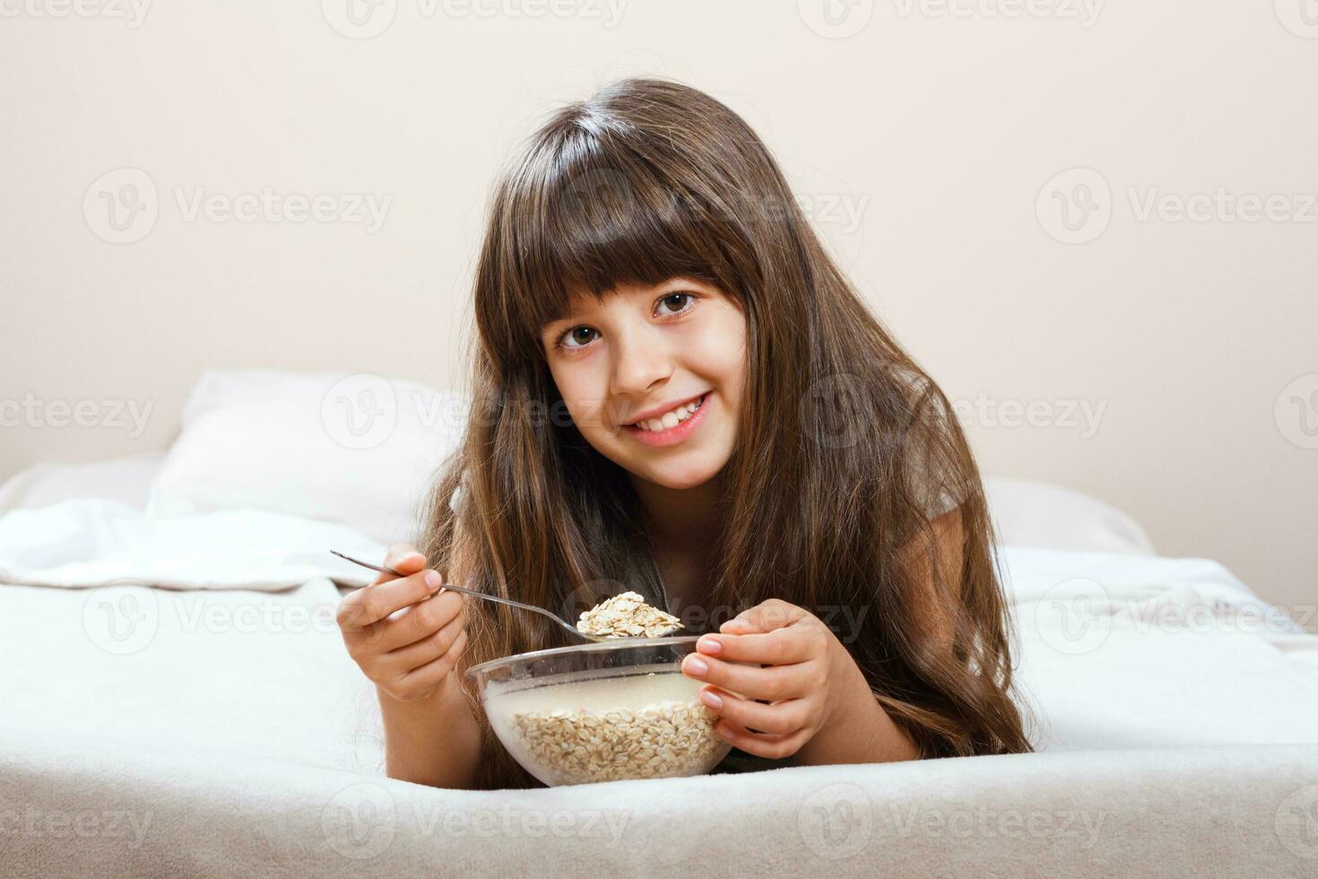 Little girl having healthy breakfast photo