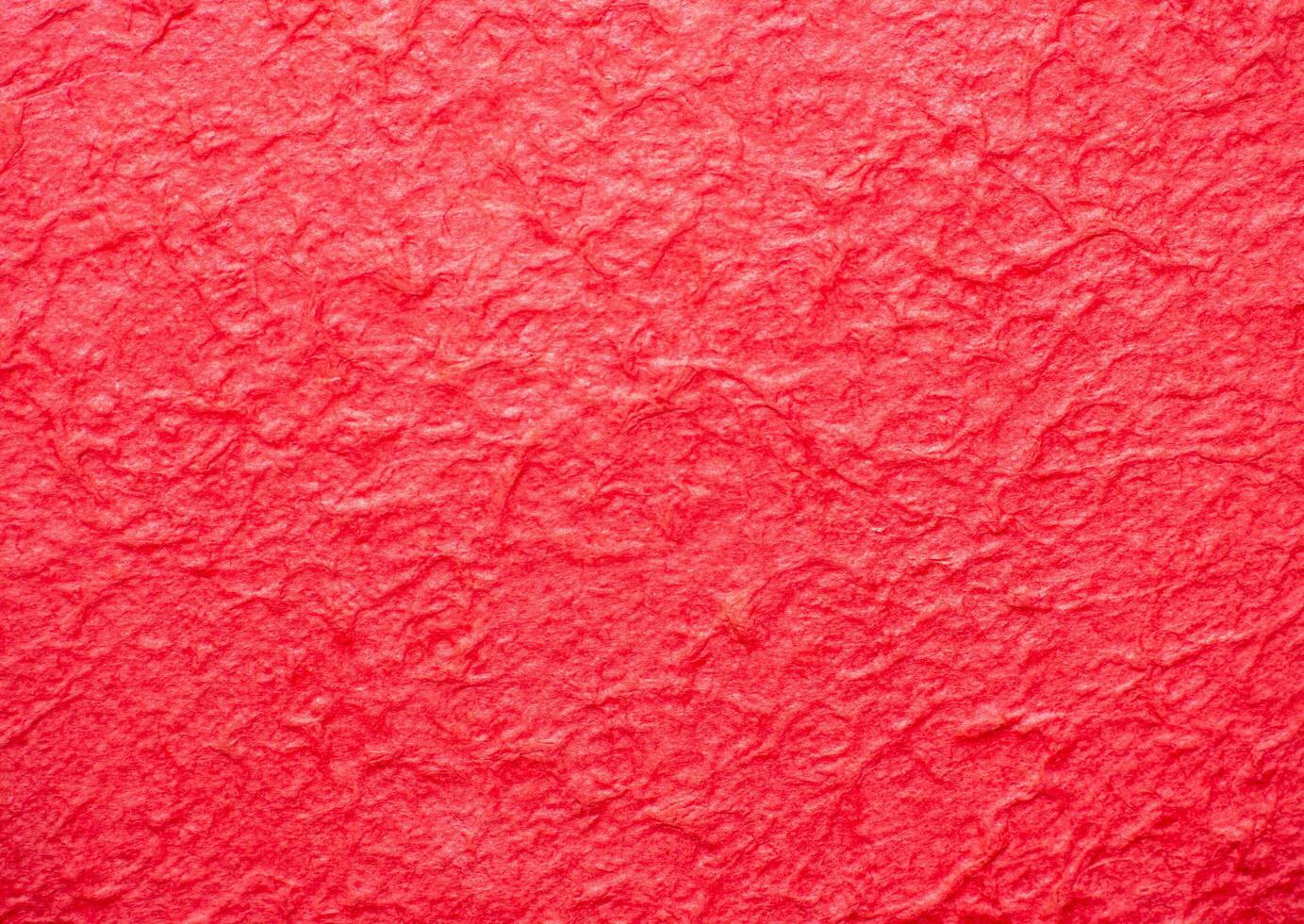 The surface of the paper is rough, crumpled, red. Rough, not smooth. use for wallpaper or background photo