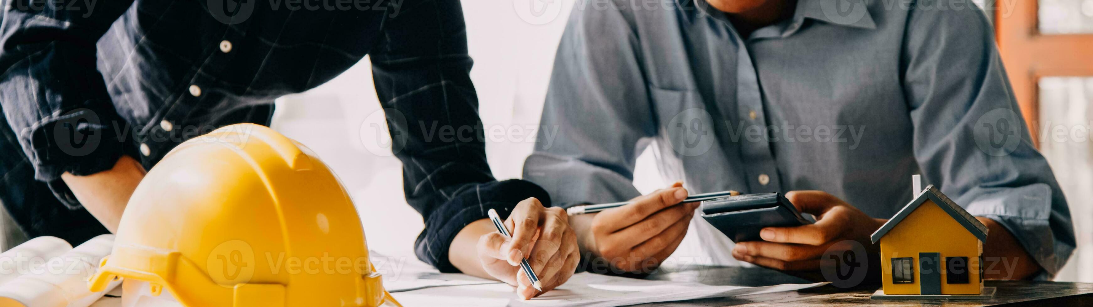 Construction and structure concept of Engineer or architect meeting for project working with partner and engineering tools on model building and blueprint in working site, contract for both companies. photo