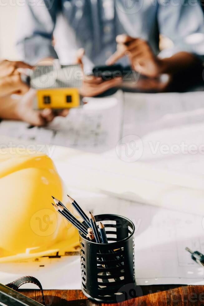 architect man working with laptop and blueprints,engineer inspection in workplace for architectural plan,sketching a construction project ,selective focus,Business concept vintage color photo