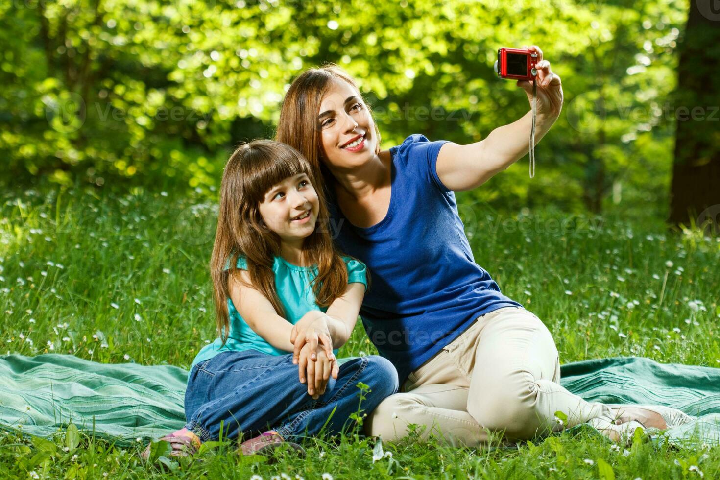 Mother and daughter taking  selfie photo