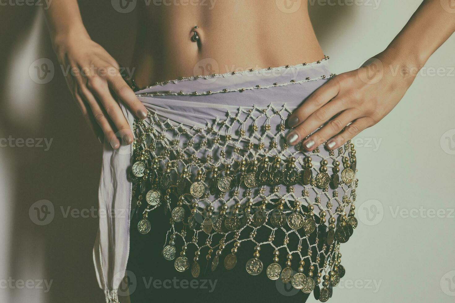 Close up stomach of belly dancer.Toned photo. photo