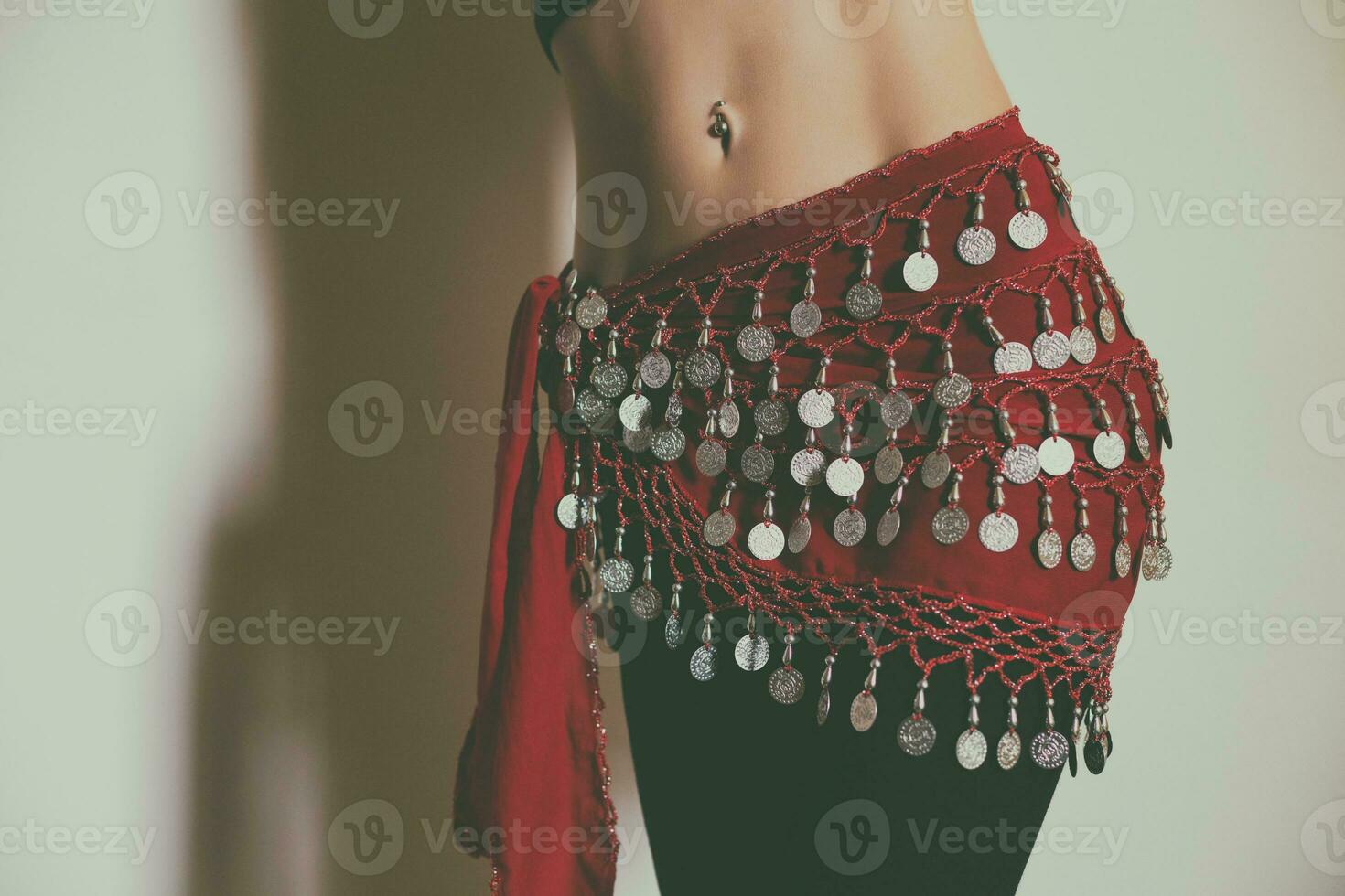 Close up stomach of belly dancer.Toned photo. photo