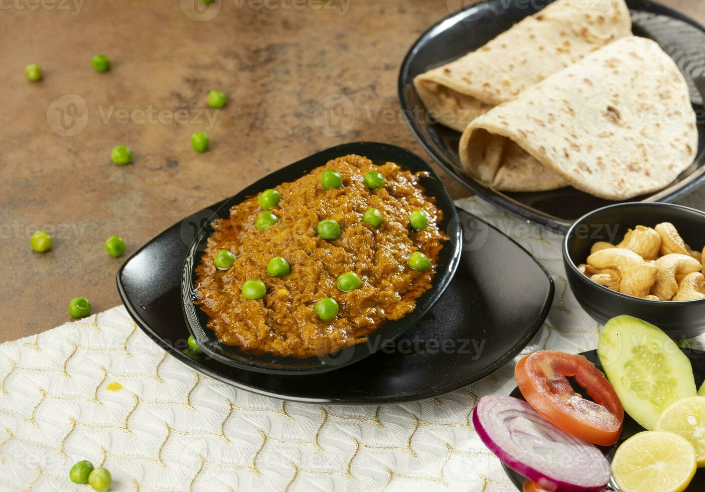 Rajasthani Famous Traditional Cuisine Haldi Sabji or Tukkar Served with Salad on White Background photo
