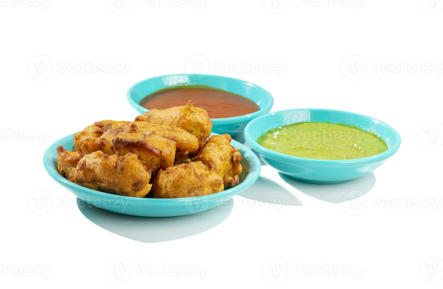 Indian Traditional Paneer Pakora or Pakoda Snacks on White Background photo