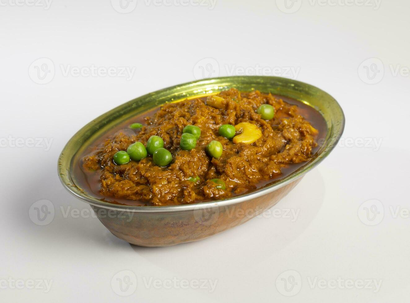 Rajasthani Famous Traditional Cuisine Haldi Sabji or Tukkar Served with Salad on White Background photo