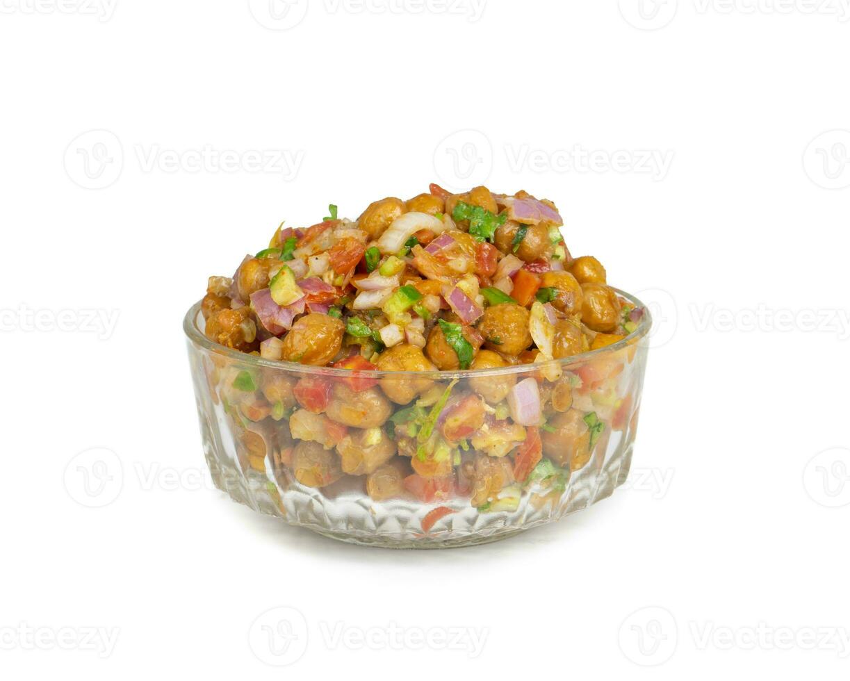 Indian Street Breakfast Chana Chaat Also Know as Chana Masala, Chola Chana Chaat, Chola Masala, Chickpea Masala, Black Chickpea Chaat or Kala Chana Chat on White Background photo