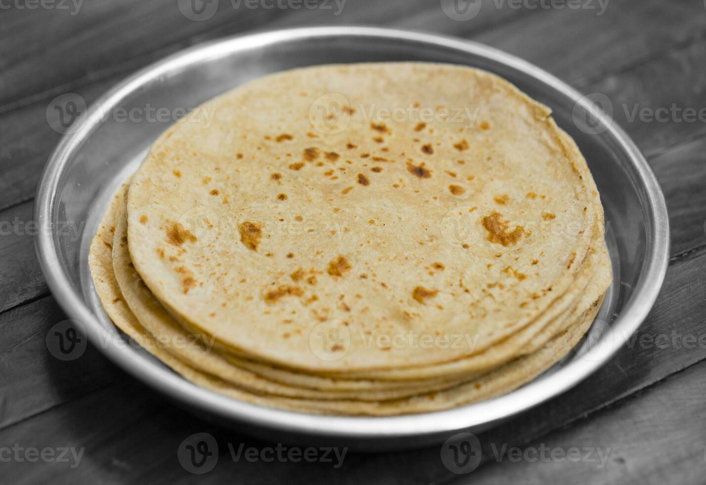 Indian Cuisine Roti Also Called Chapati on Wooden Background photo