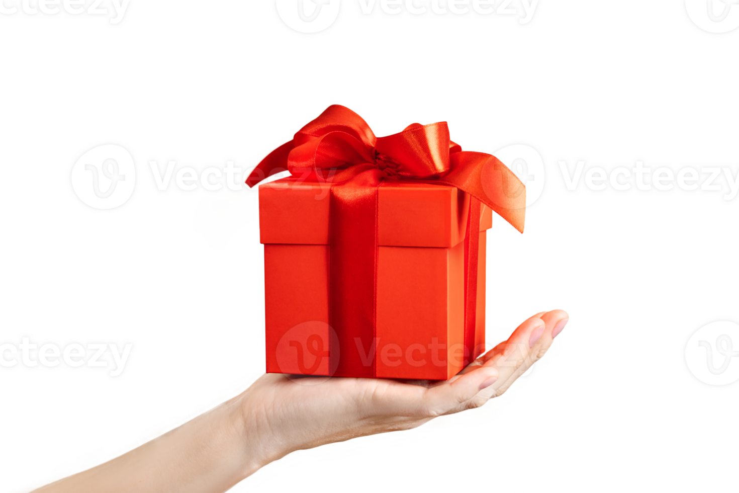 A woman's hand holds a gift with a red bow on a png background