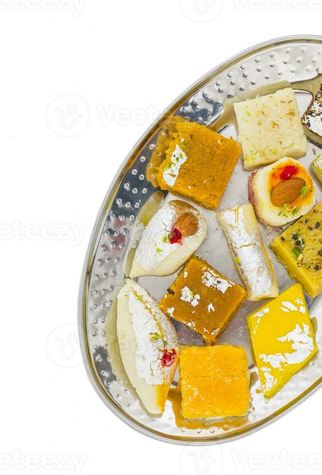 Indian Delicious Mix Sweet Food or Mix Mithai on White Background photo