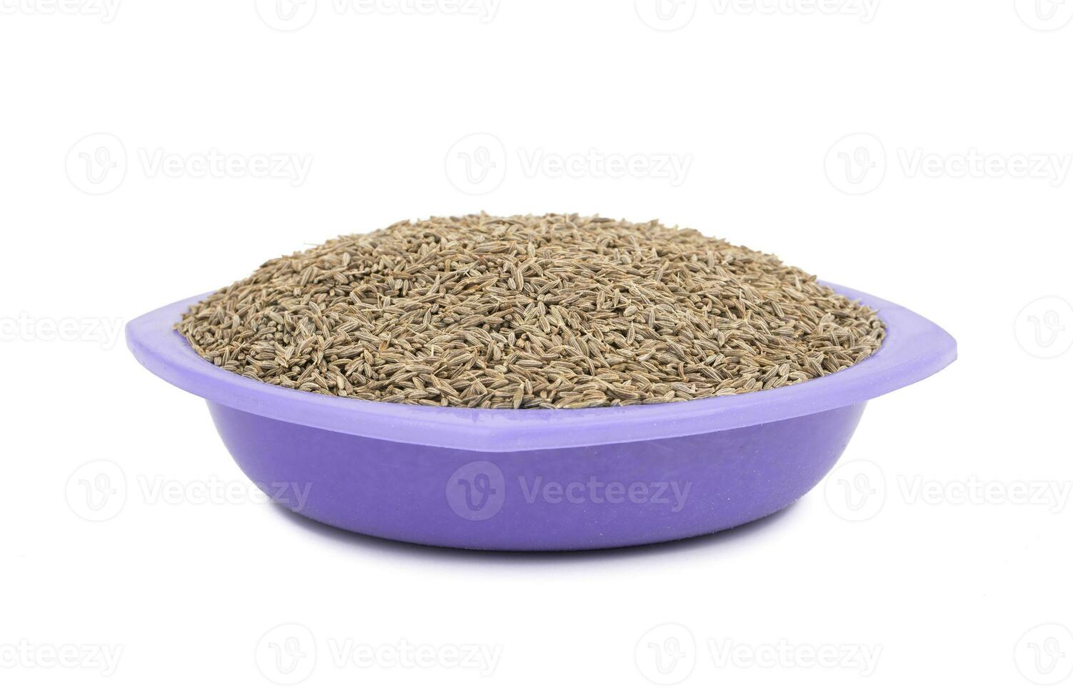 Pile of Dried Cumin Seeds on white Background photo