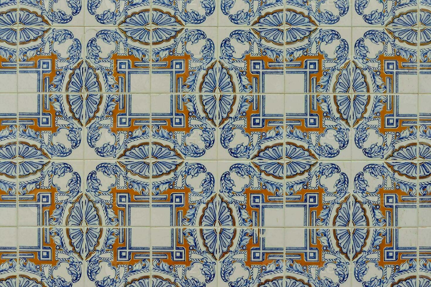 a tile with blue and orange designs on it photo