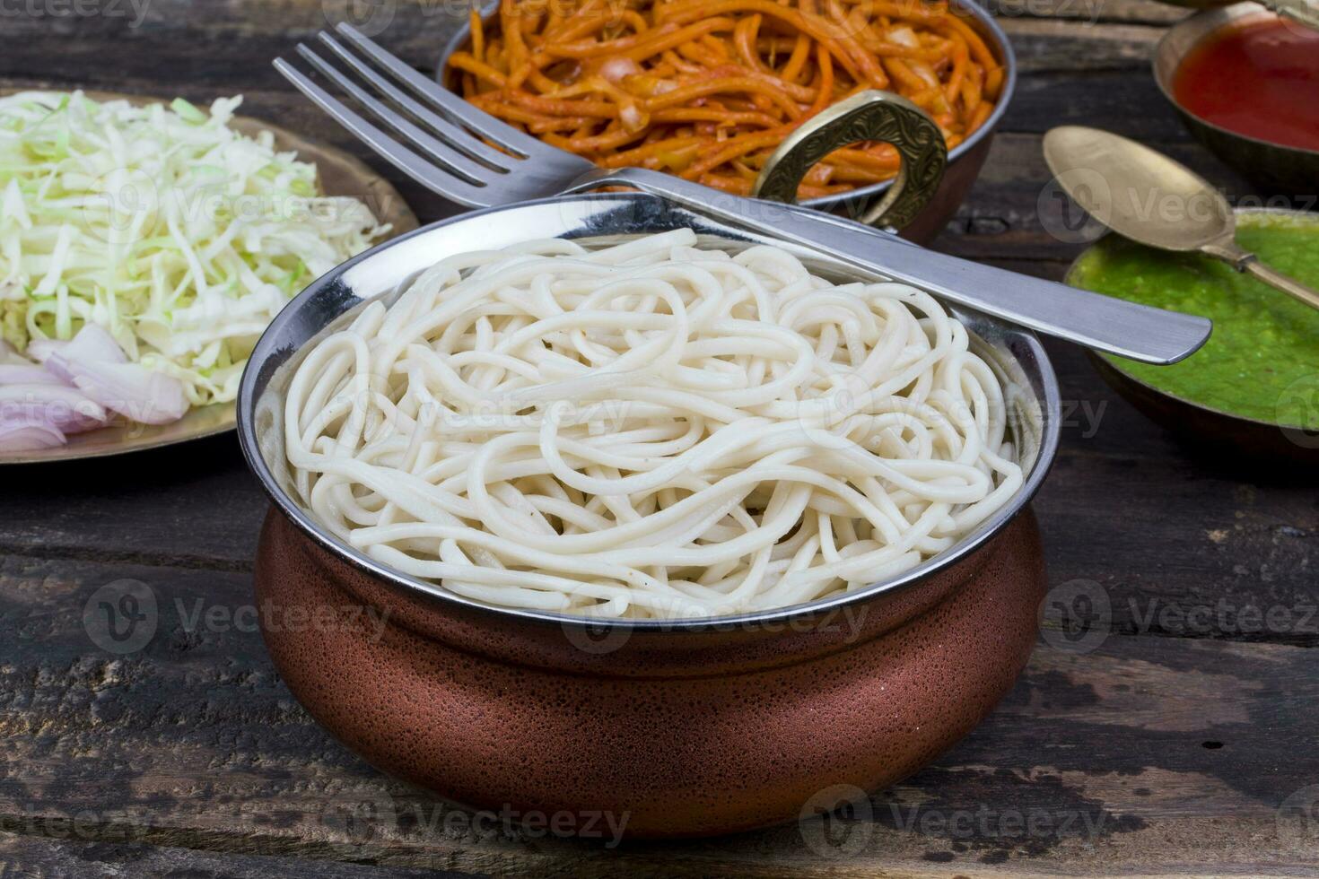 Boiled Chow Mein or Hakka Noodles Served With Chutney on Wooden Background photo