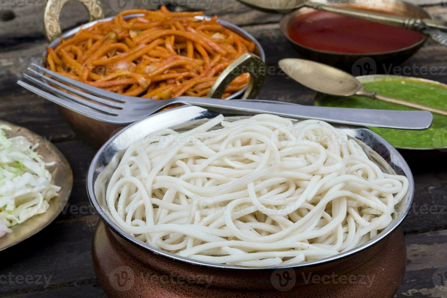 Boiled Chow Mein or Hakka Noodles Served With Chutney on Wooden Background photo