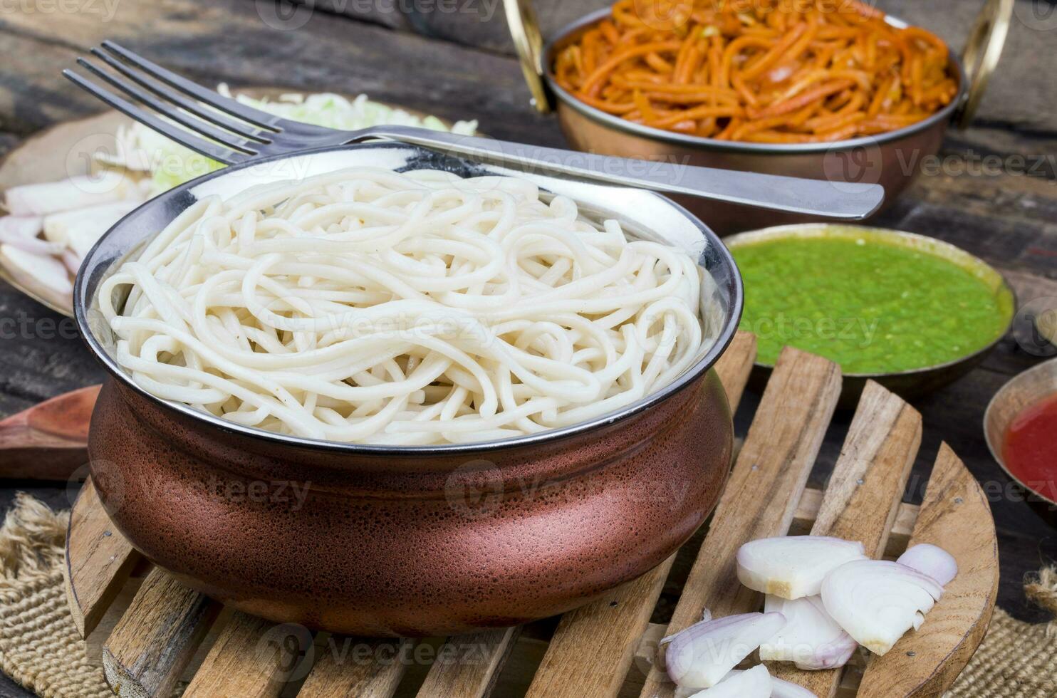 Boiled Chow Mein or Hakka Noodles Served With Chutney on Wooden Background photo