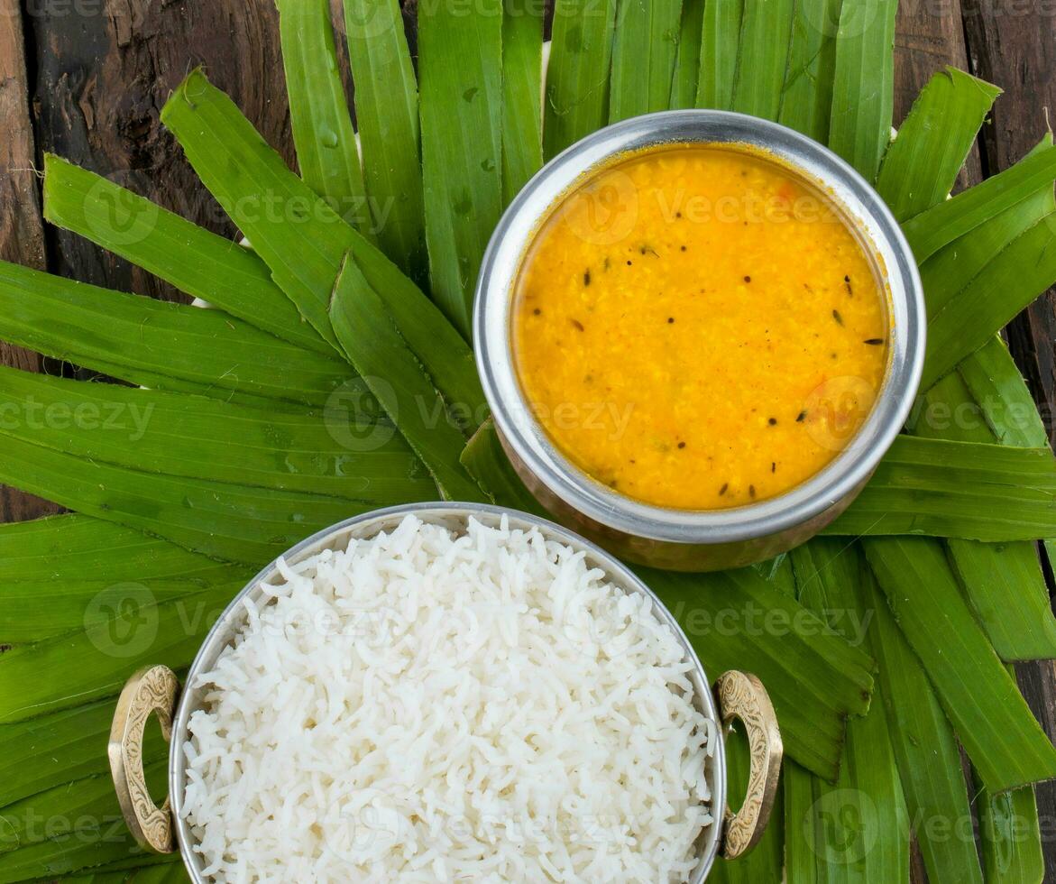 Indian Traditional Cuisine Dal Fry or Rice Also Know as Dal Chawal on Wooden Background photo