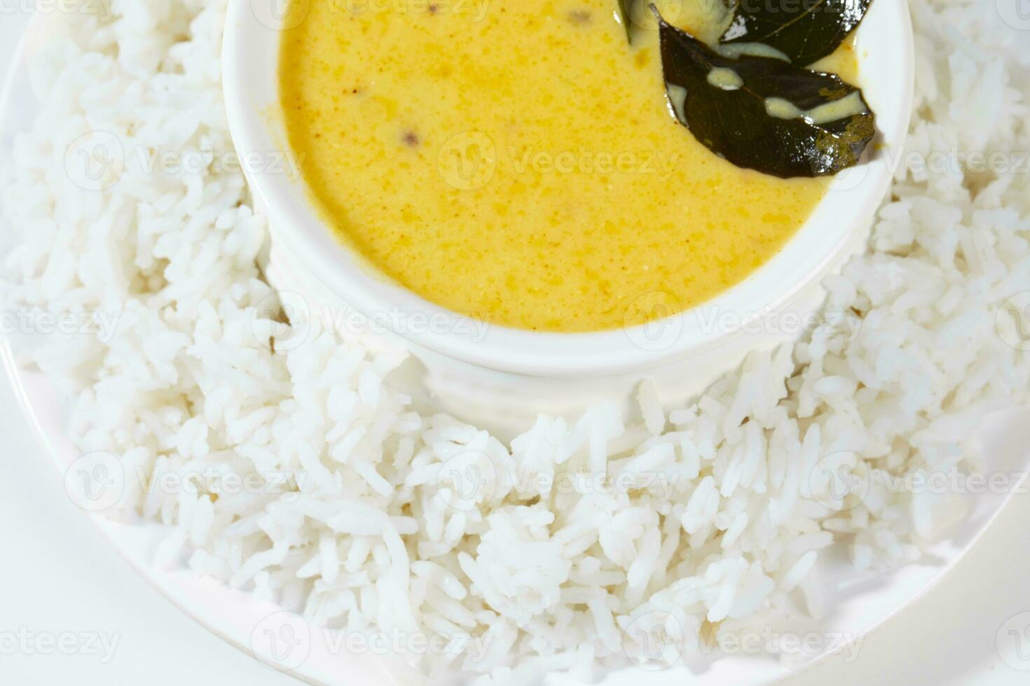 Indian Traditional Cuisine Kadhi Chawal Also Know as Curry Chawal, Yogurt Curry with Rice on White Background photo