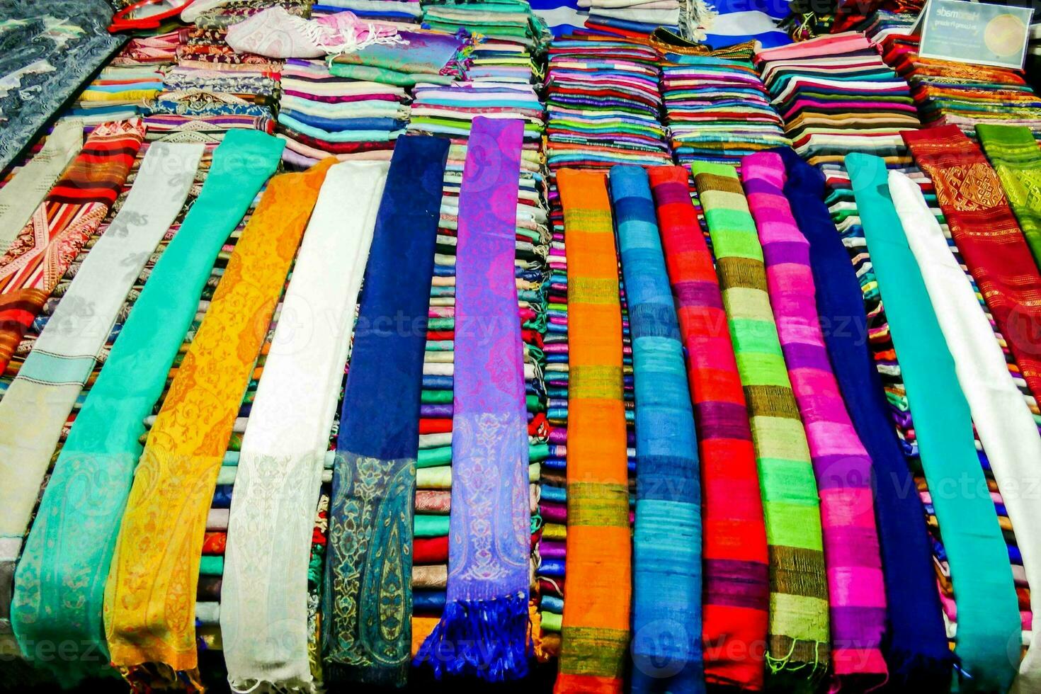 a large display of colorful scarves photo