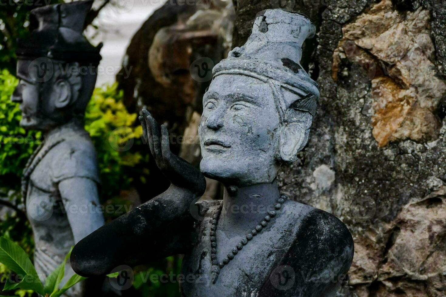old stone statues of people photo